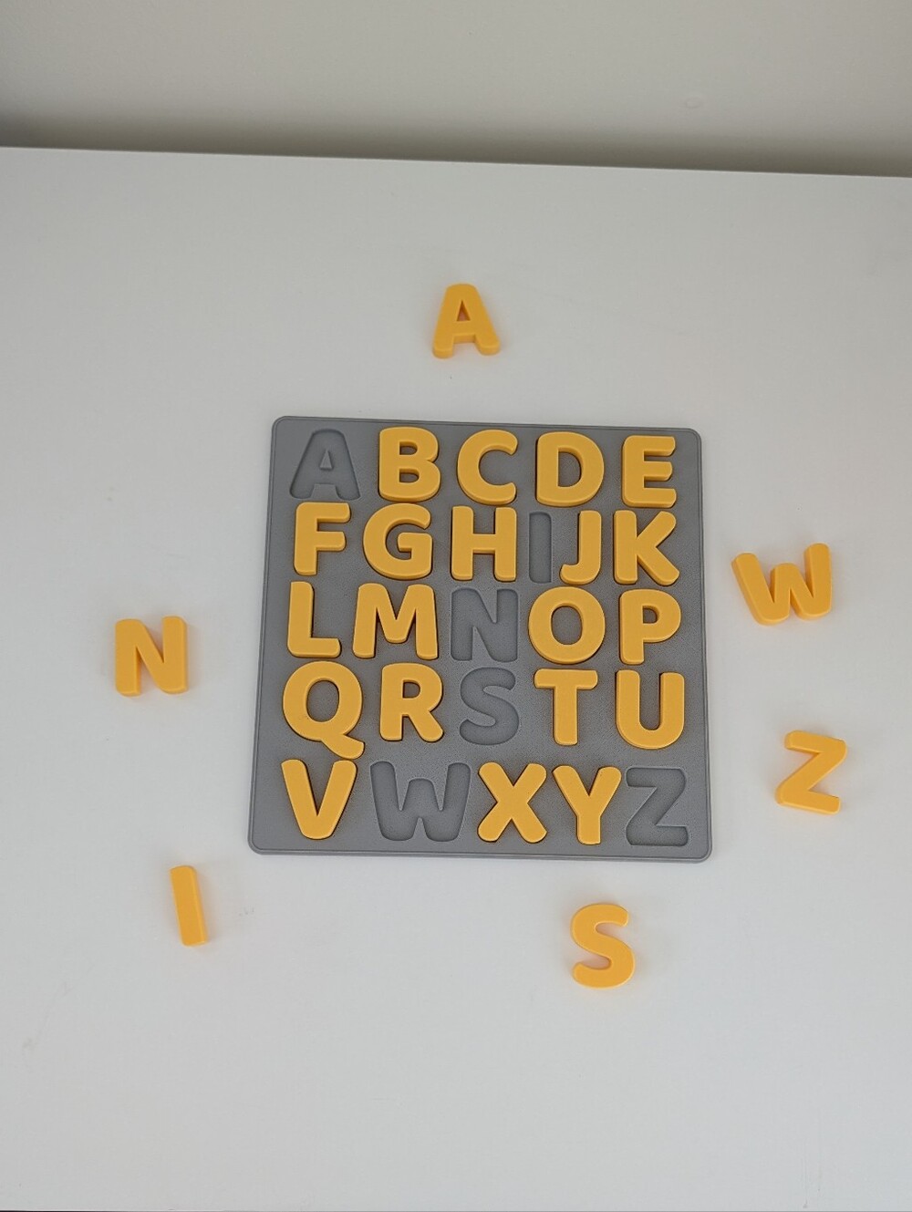 3D Printed Alphabet Alphabet Puzzle Board with Yellow Uppercase Letters